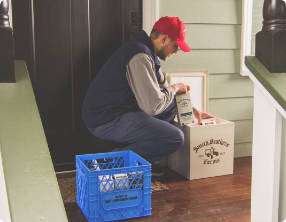 Milkman delivering porch